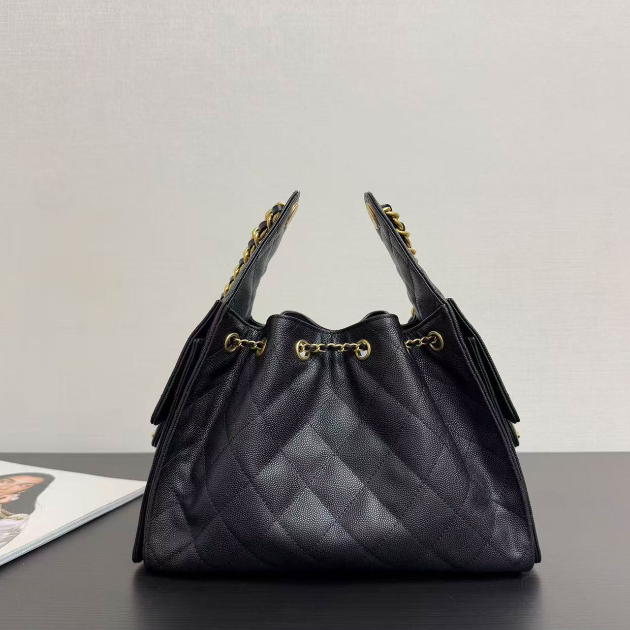 CHANEL black caviar diamond grid gold tag drawstring tote bucket bag