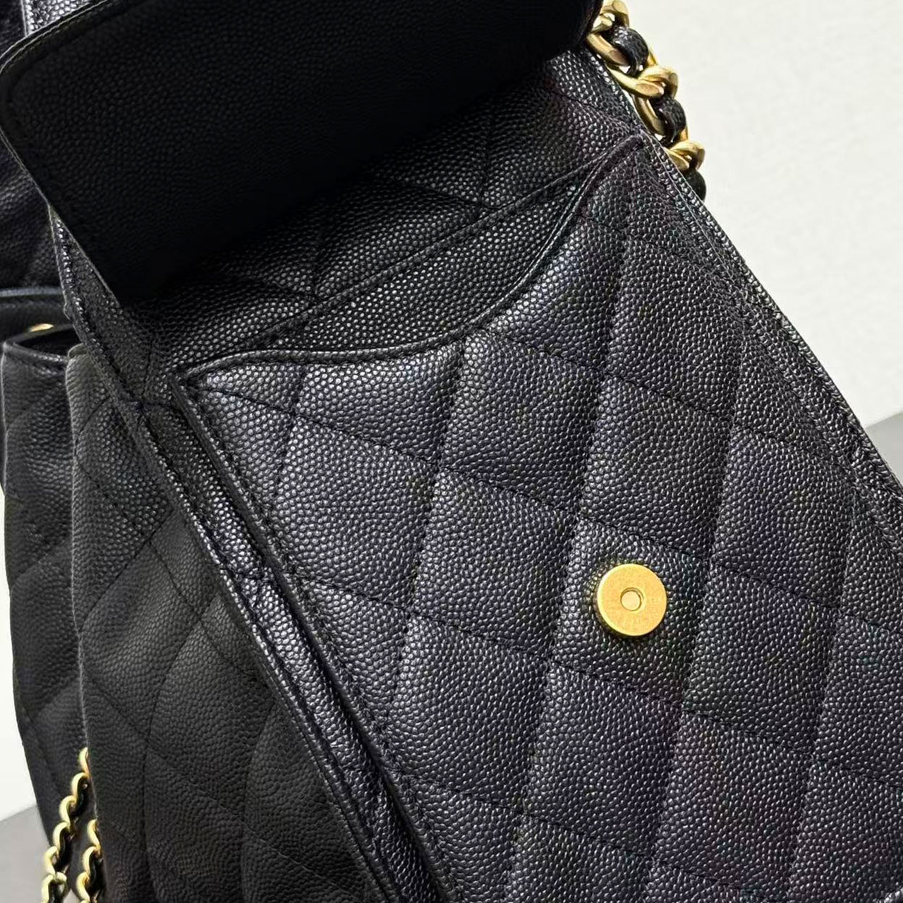 CHANEL black caviar diamond grid gold tag drawstring tote bucket bag
