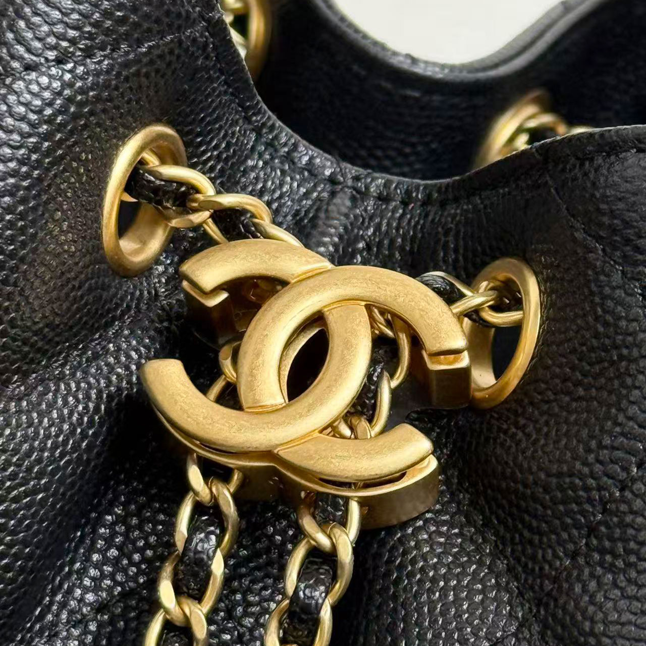 CHANEL black caviar diamond grid gold tag drawstring tote bucket bag