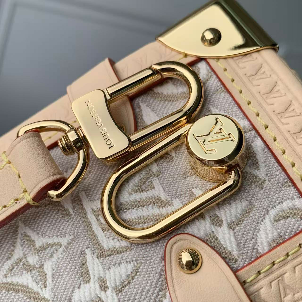 LV light white relief old flower woven hand-held hard box crossbody bag
