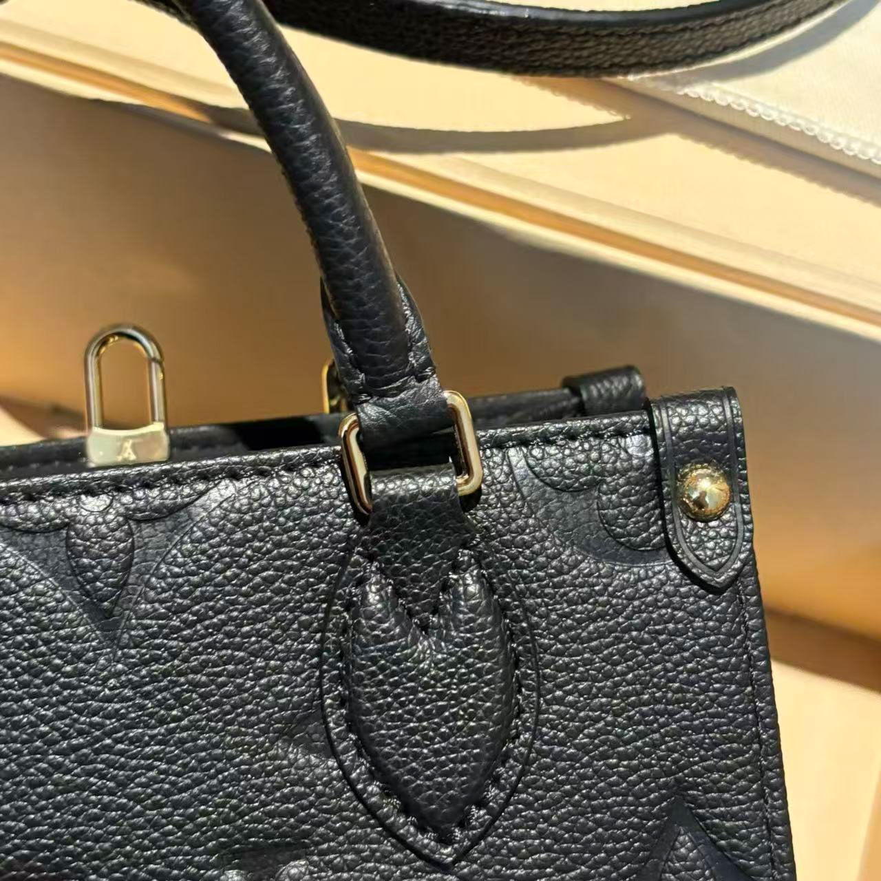 LV black embossed cowhide mini Onthego tote bag