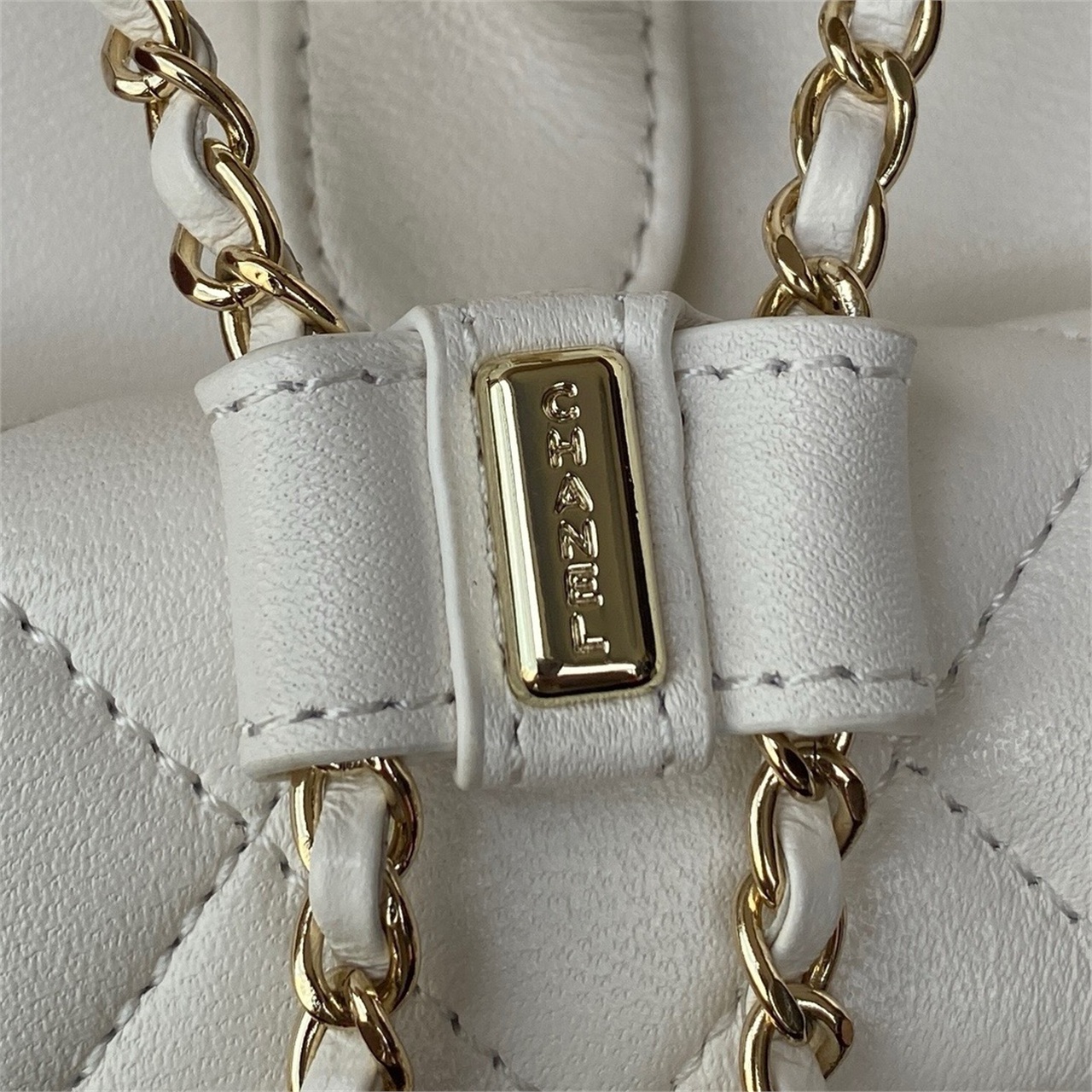 CHANEL beige lambskin diamond grid mini backpack