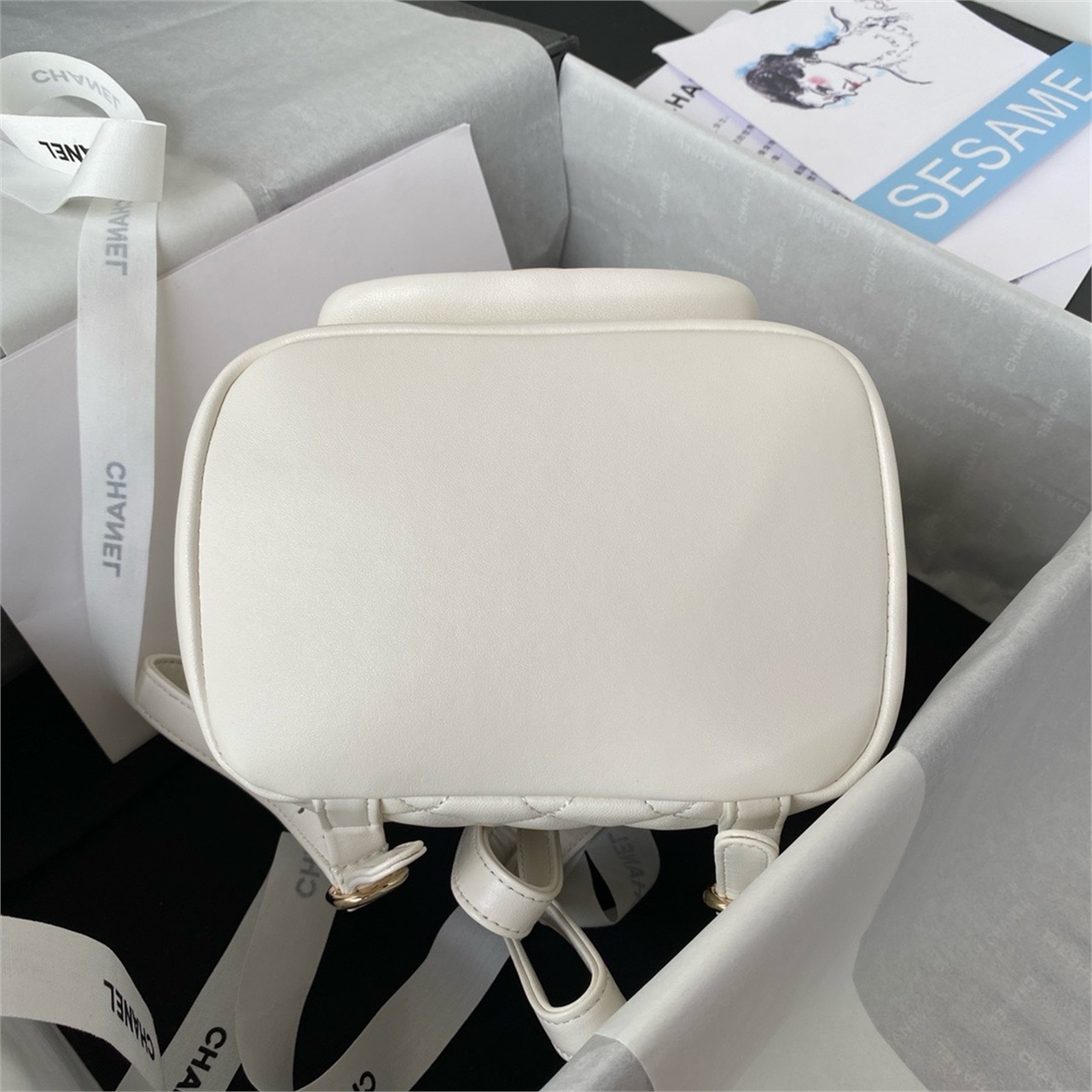 CHANEL beige lambskin diamond grid mini backpack