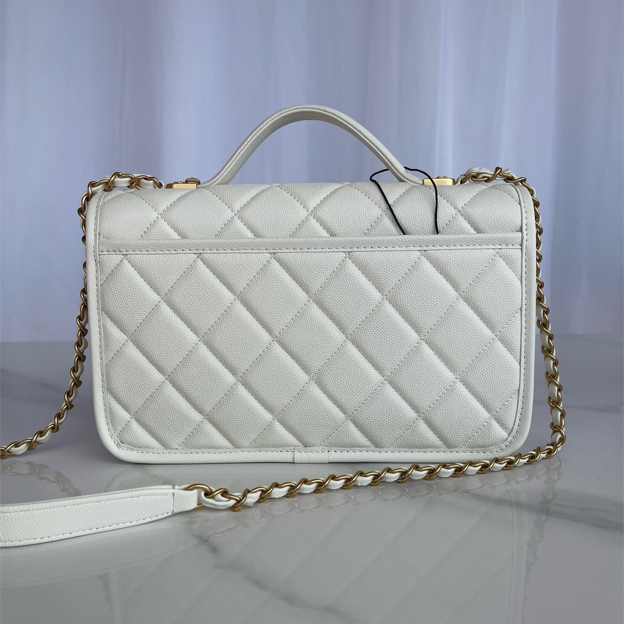 CHANEL beige caviar cowhide hand-held CF tag chain bag
