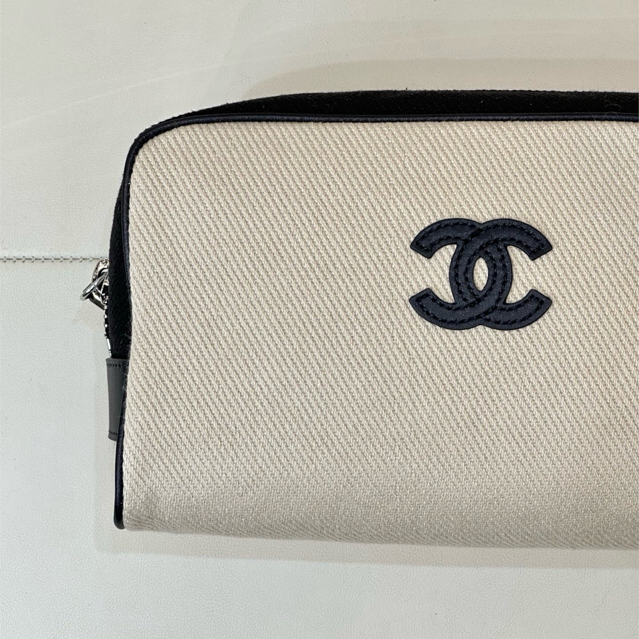 CHANEL white canvas with black leather zipper makeup storage handbag