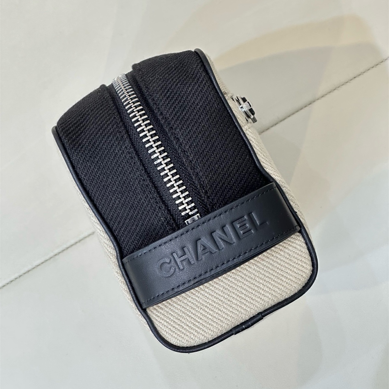 CHANEL white canvas with black leather zipper makeup storage handbag
