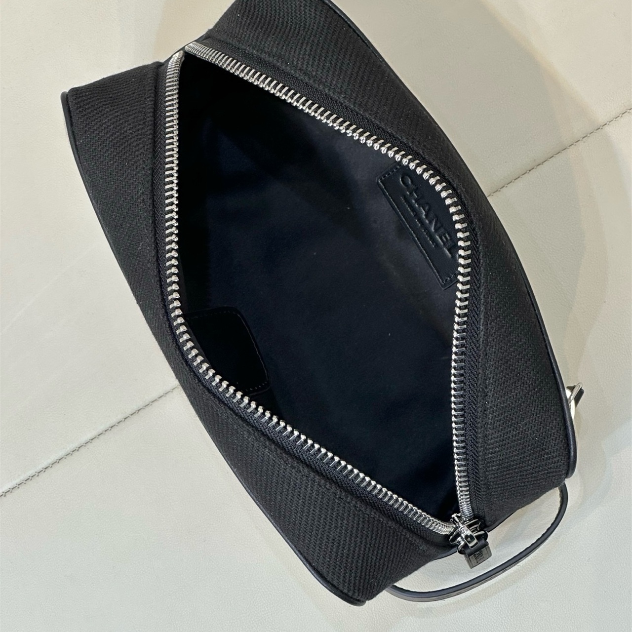 CHANEL white canvas with black leather zipper makeup storage handbag