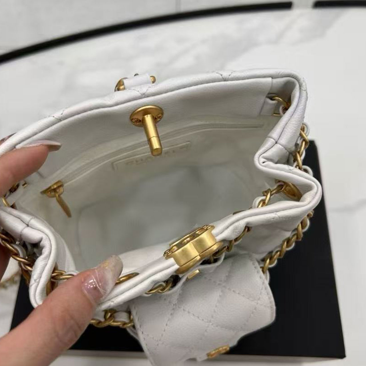 CHANEL milk white caviar diamond grid mini mother and child drawstring bucket bag