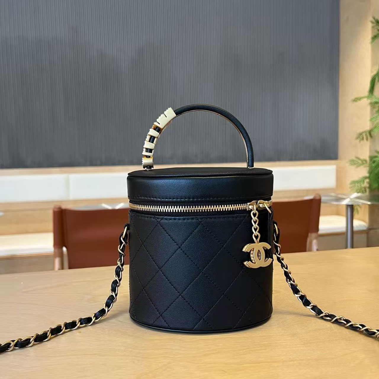 CHANEL black glossy cowhide diamond grid cylindrical makeup bucket bag